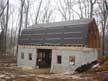 Finally, the tar paper is up! Now a few more strips of wood to hold the tar paper down in the wind. Next step will be the steel roof.