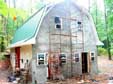 Using Scaffolding to apply scratch coat, then brown coat, then stucco. Lots of movement of the scaffolding.
